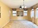 Inviting living room features neutral walls, modern ceiling fan, and plush carpet at 8477 Orly Ave, Las Vegas, NV 89143