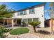 Landscaped backyard with patio cover and stone fire pit perfect for relaxing and entertaining at 8743 Mount Mira Loma Ave, Las Vegas, NV 89178