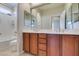 Bright bathroom features double sink vanity, soaking tub, and shower with neutral color palette at 8743 Mount Mira Loma Ave, Las Vegas, NV 89178