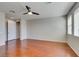 Open bedroom with ceiling fan, two bright windows, and closet for storing clothes at 8743 Mount Mira Loma Ave, Las Vegas, NV 89178