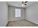 Bedroom features neutral paint, ceiling fan, and carpet flooring at 8743 Mount Mira Loma Ave, Las Vegas, NV 89178