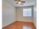 This bedroom features wood laminate floors and a ceiling fan at 8743 Mount Mira Loma Ave, Las Vegas, NV 89178
