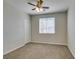 Bedroom with neutral paint, ceiling fan, and window with blinds at 8743 Mount Mira Loma Ave, Las Vegas, NV 89178