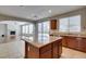 Open-concept kitchen with an island and seamlessly connected to the living room, creating a spacious area at 8743 Mount Mira Loma Ave, Las Vegas, NV 89178