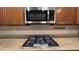 This kitchen features a stainless steel microwave and a gas cooktop at 8743 Mount Mira Loma Ave, Las Vegas, NV 89178