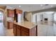 Island kitchen offering seamless transition to the fireplace and living room at 8743 Mount Mira Loma Ave, Las Vegas, NV 89178