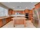 Modern kitchen featuring a center island, stainless steel appliances, and generous storage cabinets at 8743 Mount Mira Loma Ave, Las Vegas, NV 89178