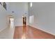 Bright, open-concept living space with hardwood floors, soaring ceilings, and arched doorways at 8743 Mount Mira Loma Ave, Las Vegas, NV 89178