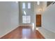 Light-filled living room with two-story ceilings, hardwood floors, arched doorways, and a grand feel at 8743 Mount Mira Loma Ave, Las Vegas, NV 89178
