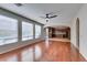 Spacious living room with hardwood floors, recessed lighting, and an open concept to the kitchen at 8743 Mount Mira Loma Ave, Las Vegas, NV 89178