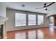 Open living room concept featuring windows, hardwood floors and ceiling fan at 8743 Mount Mira Loma Ave, Las Vegas, NV 89178