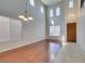 Open living room featuring lots of natural light from multiple windows and soaring ceilings at 8743 Mount Mira Loma Ave, Las Vegas, NV 89178