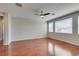 Spacious living room boasts large windows, modern ceiling fan, and beautiful, durable flooring at 8743 Mount Mira Loma Ave, Las Vegas, NV 89178