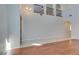 Spacious living room with soaring ceilings, hardwood floors, a stylish chandelier, and a large front door at 8743 Mount Mira Loma Ave, Las Vegas, NV 89178