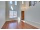 Bright, airy living room with hardwood floors, tall windows, and a grand two-story entrance at 8743 Mount Mira Loma Ave, Las Vegas, NV 89178
