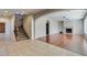 Open living area with fireplace, staircase and tile and wood flooring at 8743 Mount Mira Loma Ave, Las Vegas, NV 89178