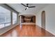 Open-concept living room with hardwood floors and a seamless transition to the kitchen area at 8743 Mount Mira Loma Ave, Las Vegas, NV 89178