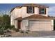 Charming two-story home featuring a neutral color palette, well-maintained landscaping and a two-car garage at 9135 Eagle Ford St, Las Vegas, NV 89113