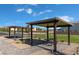 Community picnic area with shaded pergolas, seating, and well-kept landscaping at 9135 Eagle Ford St, Las Vegas, NV 89113