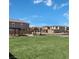 Community green space with picnic area and ample room for activities on a sunny day at 9141 Eagle Ford St, Las Vegas, NV 89113