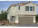 Charming two-story home features a two-car garage, neutral color palette, and a beautifully landscaped front yard at 9141 Eagle Ford St, Las Vegas, NV 89113