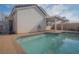 Sparkling backyard pool featuring a spacious patio area, ideal for enjoying sunny days and outdoor gatherings at 9323 W Rochelle Ave, Las Vegas, NV 89147