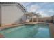 Beautiful backyard pool with a covered patio offering a relaxing outdoor space for leisure and entertaining at 9323 W Rochelle Ave, Las Vegas, NV 89147