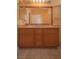 Bathroom vanity with double sinks, cabinet storage and large framed mirror at 9323 W Rochelle Ave, Las Vegas, NV 89147