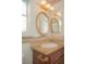 Bathroom featuring granite countertop, vanity mirror, and custom wall details at 9323 W Rochelle Ave, Las Vegas, NV 89147
