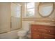 Bathroom featuring a tile floor, shower-tub combo, granite countertop, and vanity mirror at 9323 W Rochelle Ave, Las Vegas, NV 89147
