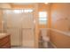 Bathroom includes glass-doored shower, modern fixtures, and a matching toilet at 9323 W Rochelle Ave, Las Vegas, NV 89147