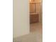 Bathroom featuring wood cabinets, a large mirror, and tile floors at 9323 W Rochelle Ave, Las Vegas, NV 89147