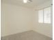 Bedroom featuring neutral walls, carpet flooring, ceiling fan, and window with blinds at 9323 W Rochelle Ave, Las Vegas, NV 89147