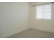 Bedroom features neutral walls, carpet flooring, and window with blinds at 9323 W Rochelle Ave, Las Vegas, NV 89147