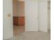 Bedroom view through the doorway, featuring a cabinet and wood-style flooring at 9323 W Rochelle Ave, Las Vegas, NV 89147