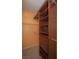 Spacious walk-in closet with custom wood shelving and drawers at 9323 W Rochelle Ave, Las Vegas, NV 89147