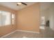 A dining area features a ceiling fan, tiled flooring, and a colorful stained glass door at 9323 W Rochelle Ave, Las Vegas, NV 89147