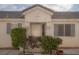 Inviting home facade with well-manicured landscaping enhancing curb appeal and creating a welcoming ambiance at 9323 W Rochelle Ave, Las Vegas, NV 89147