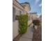 Well-maintained front yard with lush landscaping, enhancing the curb appeal of this lovely home at 9323 W Rochelle Ave, Las Vegas, NV 89147