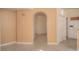 A bright hallway view with arched doorways and a neutral color palette. Offers a sense of flow and openness at 9323 W Rochelle Ave, Las Vegas, NV 89147
