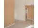 A spacious hallway view with an arched doorway and a neutral color palette. Offers a sense of flow at 9323 W Rochelle Ave, Las Vegas, NV 89147