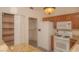 Bright kitchen featuring wood cabinets, granite countertops and modern appliances at 9323 W Rochelle Ave, Las Vegas, NV 89147