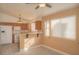 This spacious kitchen features white appliances and light brown cabinetry. Perfect for cooking and entertaining at 9323 W Rochelle Ave, Las Vegas, NV 89147