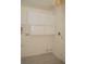 Laundry room with storage cabinets and tiled flooring at 9323 W Rochelle Ave, Las Vegas, NV 89147