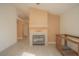 Spacious living area with fireplace and a view of the adjacent kitchen at 9323 W Rochelle Ave, Las Vegas, NV 89147