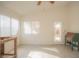 Bright living room with lots of natural light and exterior door at 9323 W Rochelle Ave, Las Vegas, NV 89147