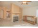 Inviting living room features a fireplace and ample natural light at 9323 W Rochelle Ave, Las Vegas, NV 89147