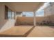Covered outdoor patio area with finished concrete and landscape lighting at 9323 W Rochelle Ave, Las Vegas, NV 89147