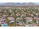 Breathtaking aerial view showcasing the estate's lush landscaping and pool at 104 N Royal Ascot Dr, Las Vegas, NV 89144
