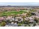 Stunning aerial view of the home and surrounding golf course and community at 104 N Royal Ascot Dr, Las Vegas, NV 89144